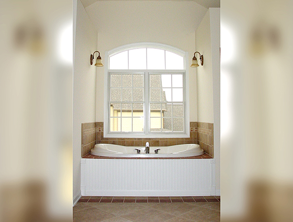 Remodeled bathroom with drop-in tub and tile deck in Naperville, IL.