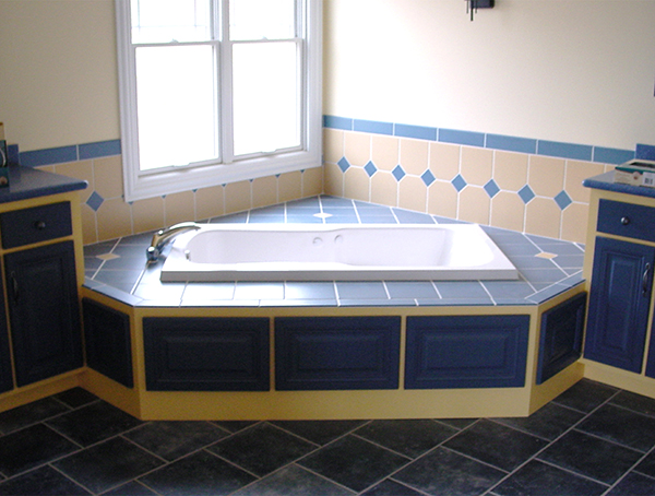 drop-in tub with blue tile decking installed in bathroom in aurora, il